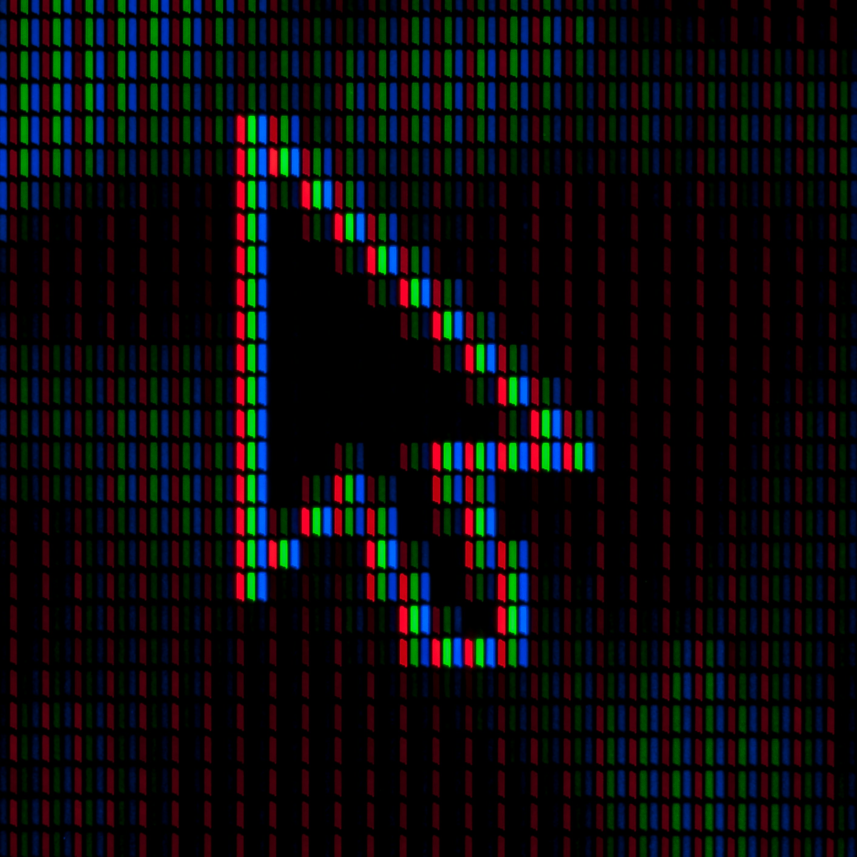 Foto door Umberto op Unsplash. Een muisaanwijzer opgebouwd uit pixels.